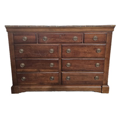 Wooden dresser with multiple drawers on a white background