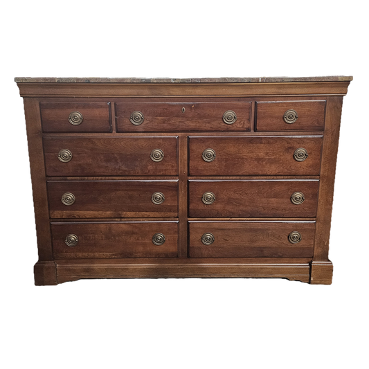 Wooden dresser with multiple drawers on a white background
