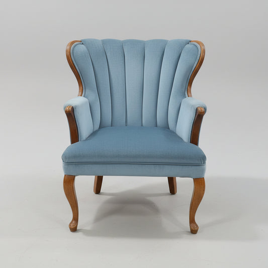Blue  Upholstered Shell Back Armchair with Carved Wood